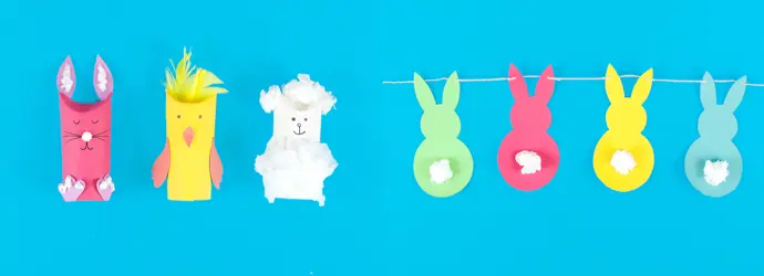 Kleurrijke paasknutsels van wc-rollen in de vorm van dieren en een slinger van kartonnen konijntjes.