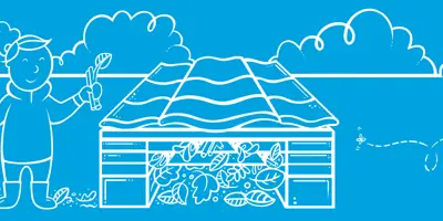 Klein meisje met vader die houten insectenhotel tegen een boom in de tuin houdt