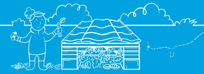 Klein meisje met vader die houten insectenhotel tegen een boom in de tuin houdt